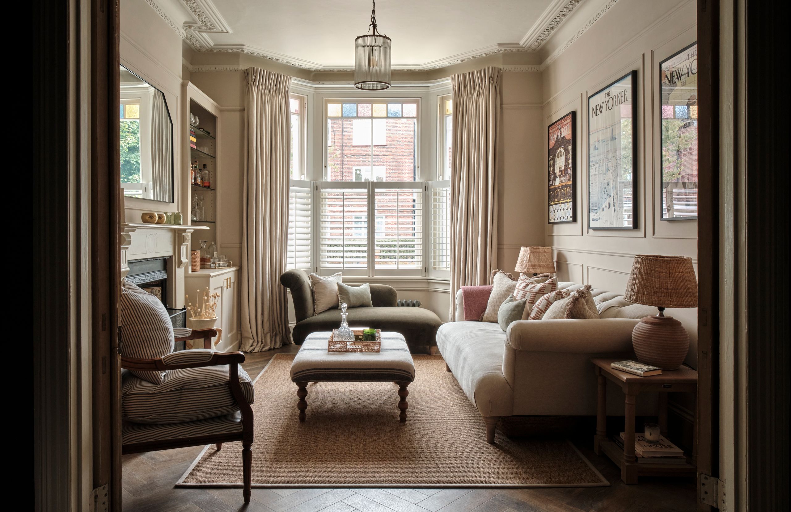 Image may contain: Book, Publication, Lamp, Home Decor, Rug, Couch, Furniture, Chair, Window, Architecture, and Building