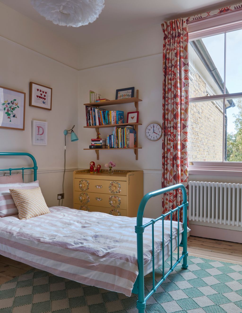 Image may contain Bed Furniture Home Decor Art Painting Rug Lamp Indoors Interior Design and Person