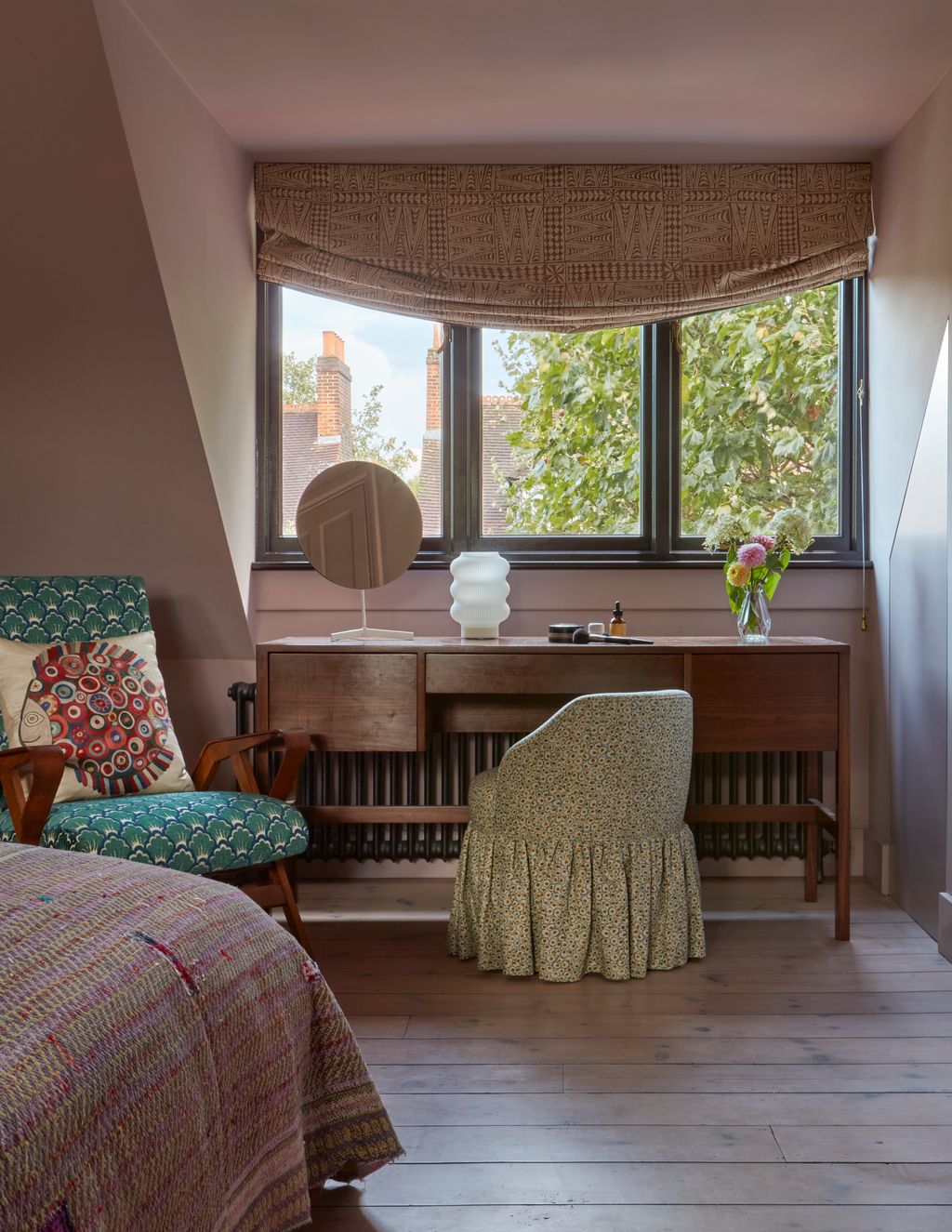 Image may contain Chair Furniture Desk Table Window Home Decor Indoors Interior Design Bed Bay Window and Cup