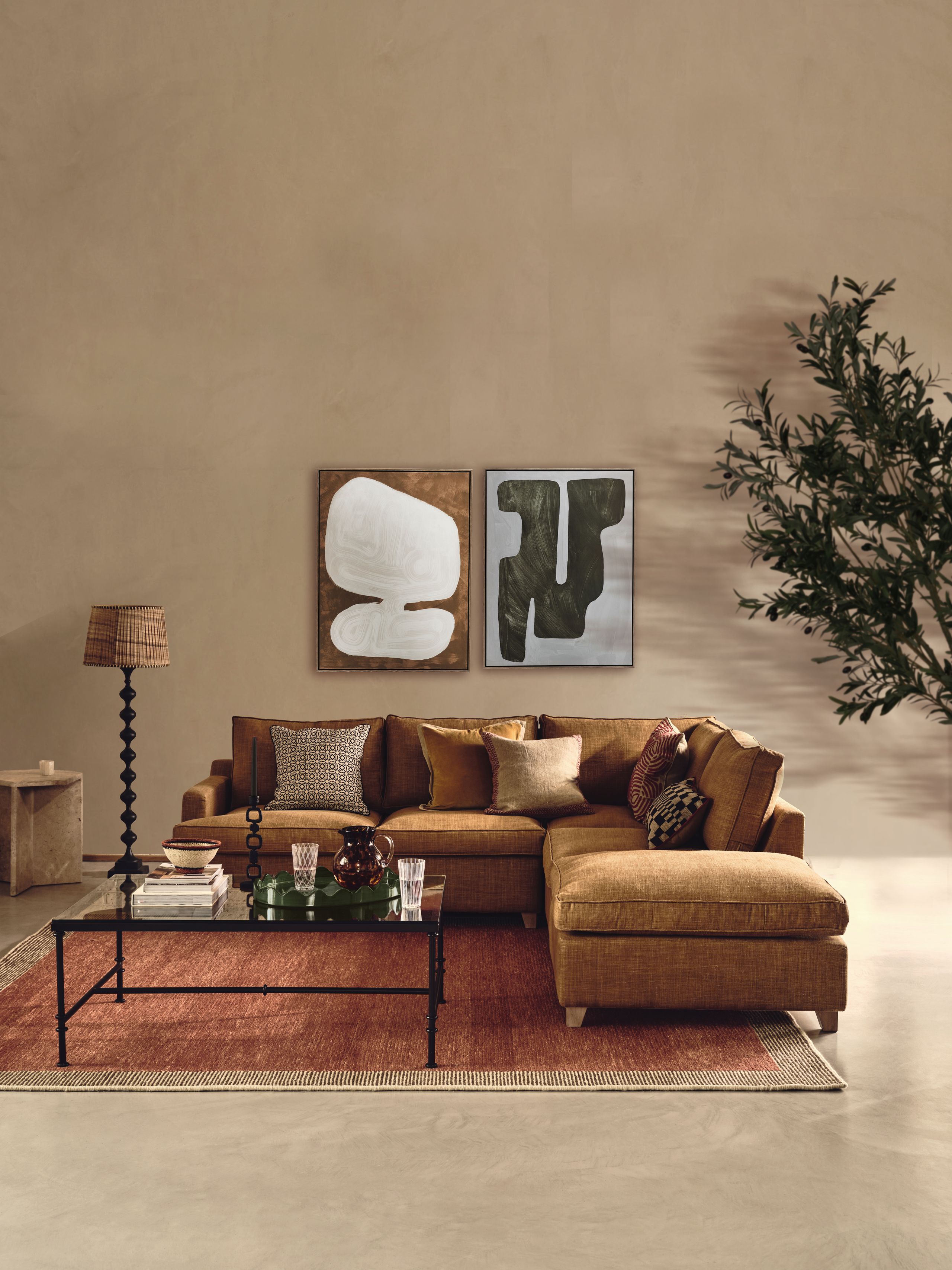 Image may contain: Home Decor, Lamp, Furniture, Table, Couch, Coffee Table, Cup, Rug, Architecture, Building, and Indoors