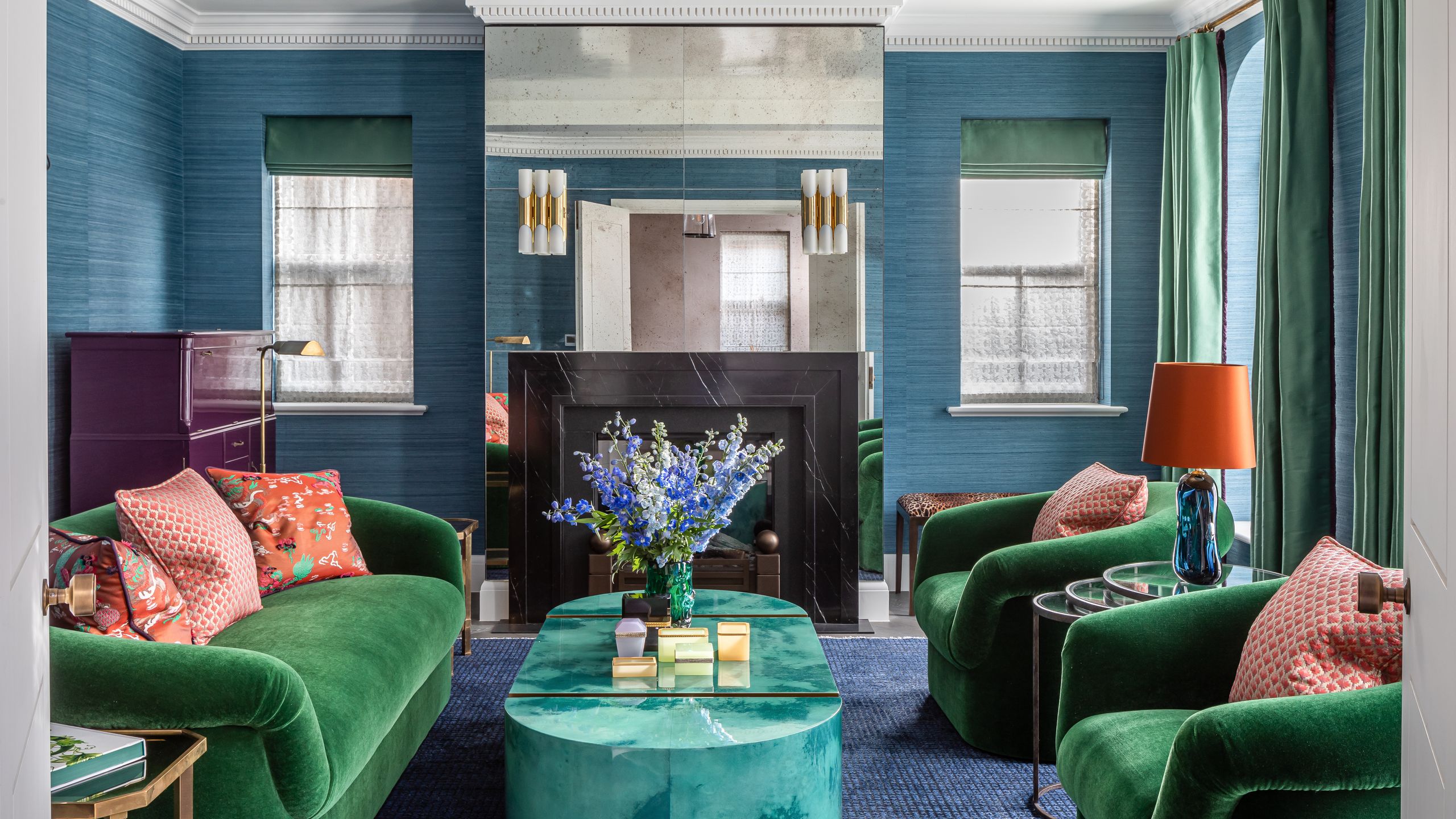 Image may contain: Lamp, Home Decor, Couch, Furniture, Architecture, Building, Indoors, Living Room, Room, and Coffee Table