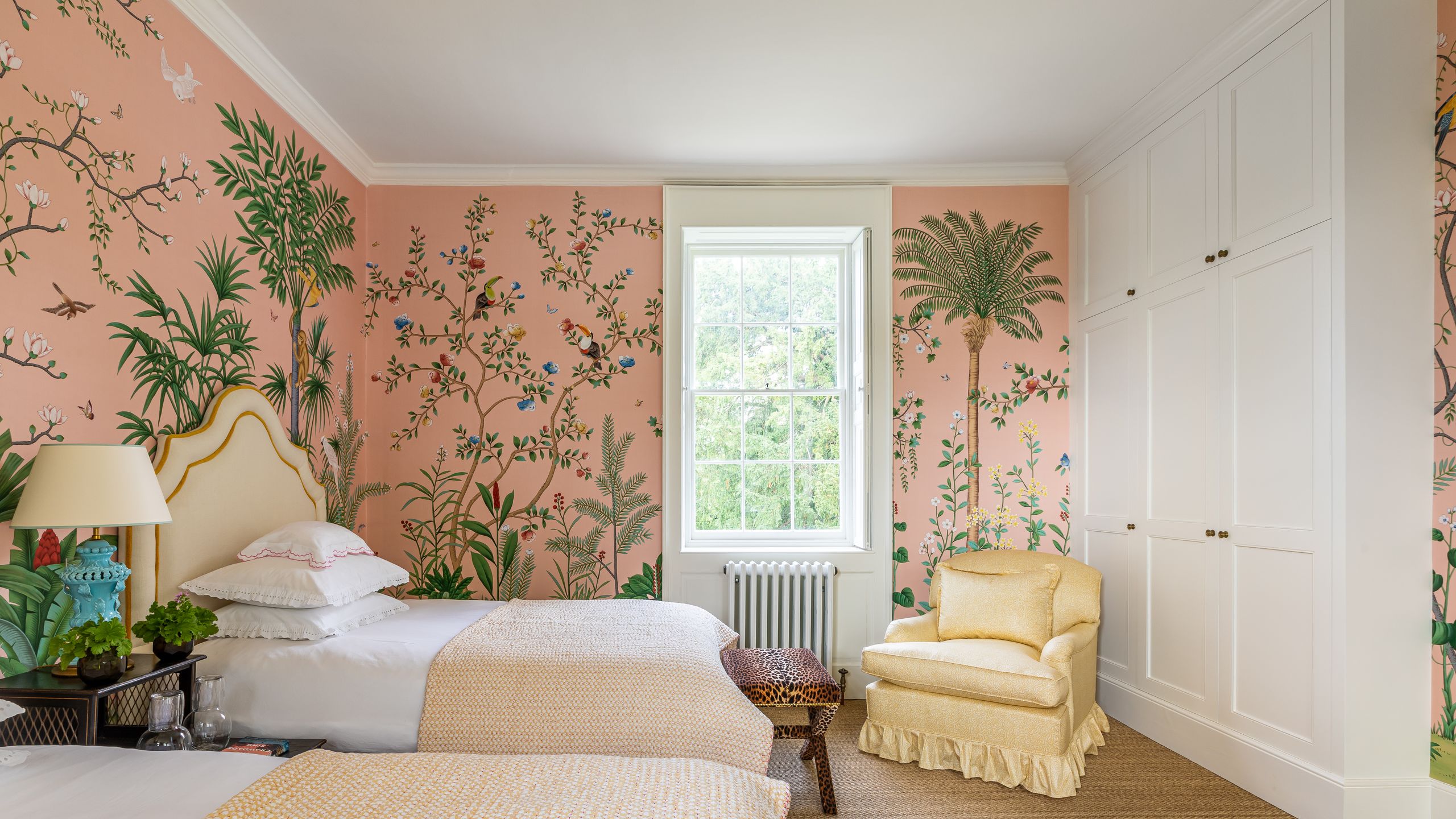 Image may contain: Home Decor, Corner, Lamp, Plant, Bed, Furniture, Rug, Cushion, Chair, Indoors, and Interior Design