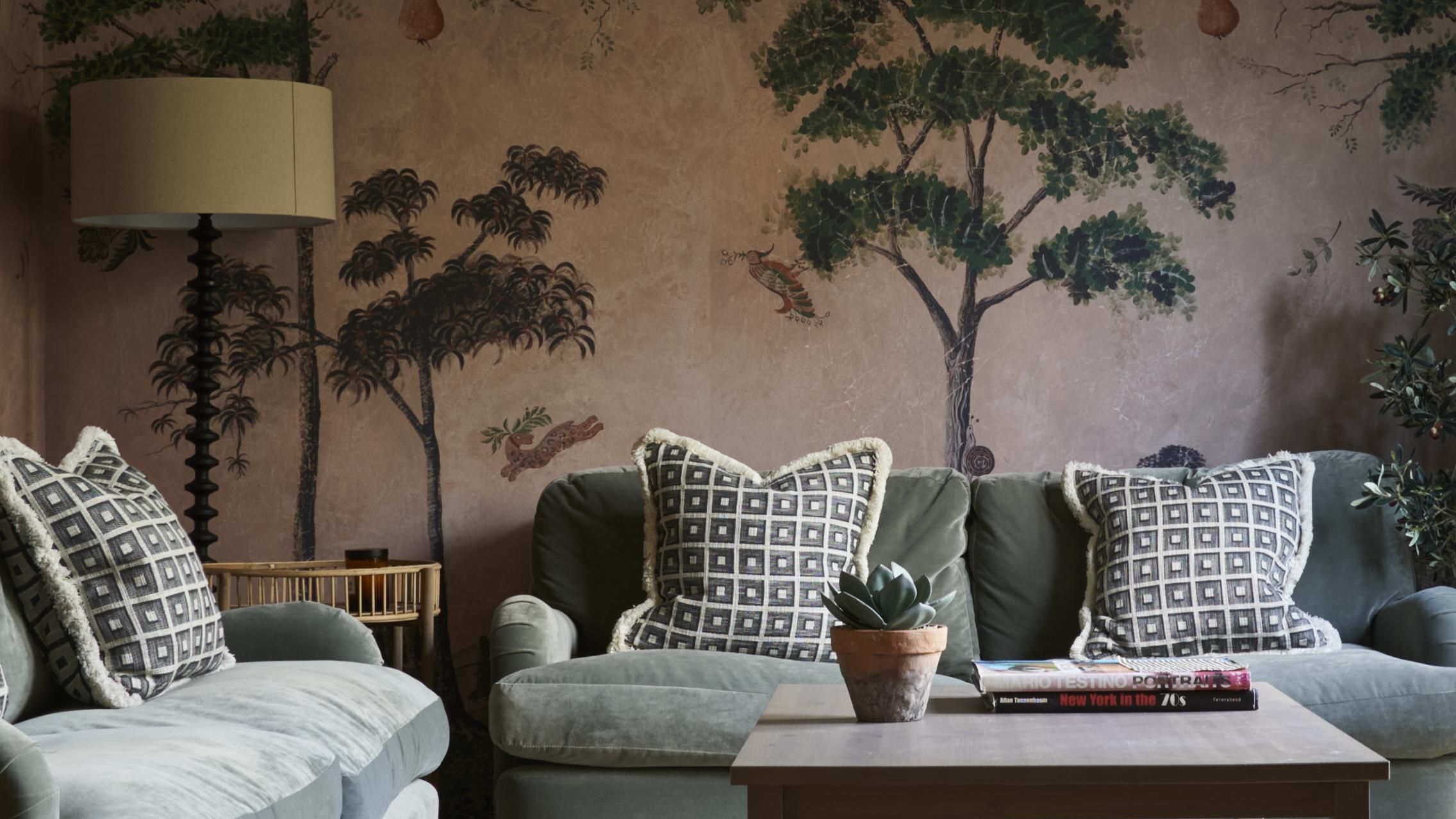 Image may contain: Architecture, Building, Furniture, Indoors, Living Room, Room, Couch, Lamp, Home Decor, Chair, and Plant