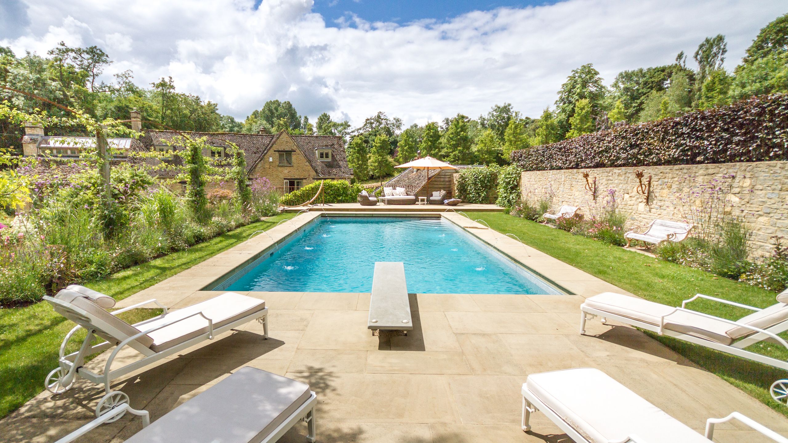 Image may contain: Architecture, Building, House, Housing, Villa, Backyard, Nature, Outdoors, Yard, Pool, and Water