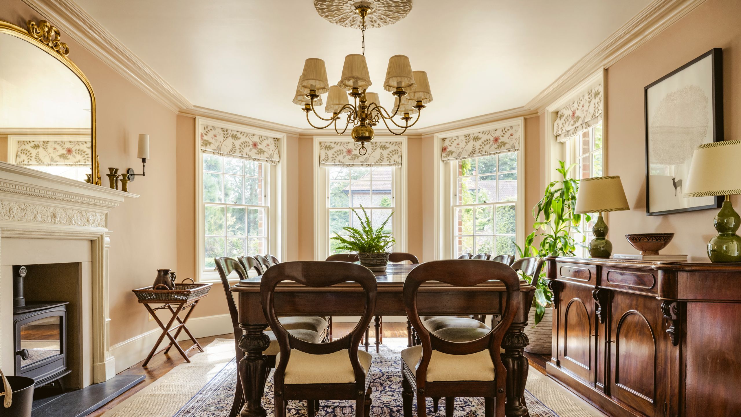 Image may contain: Architecture, Building, Dining Room, Dining Table, Furniture, Indoors, Room, Table, Chandelier, and Lamp