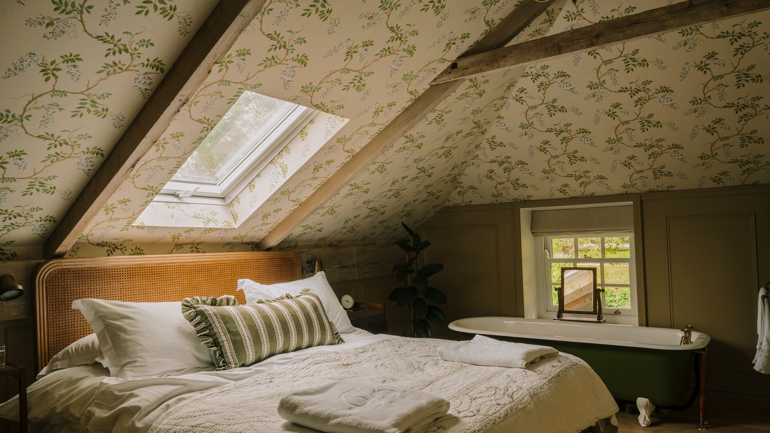 Image may contain: Architecture, Building, House, Housing, Indoors, Loft, Room, Bed, Furniture, Bathing, Bathtub, and Person