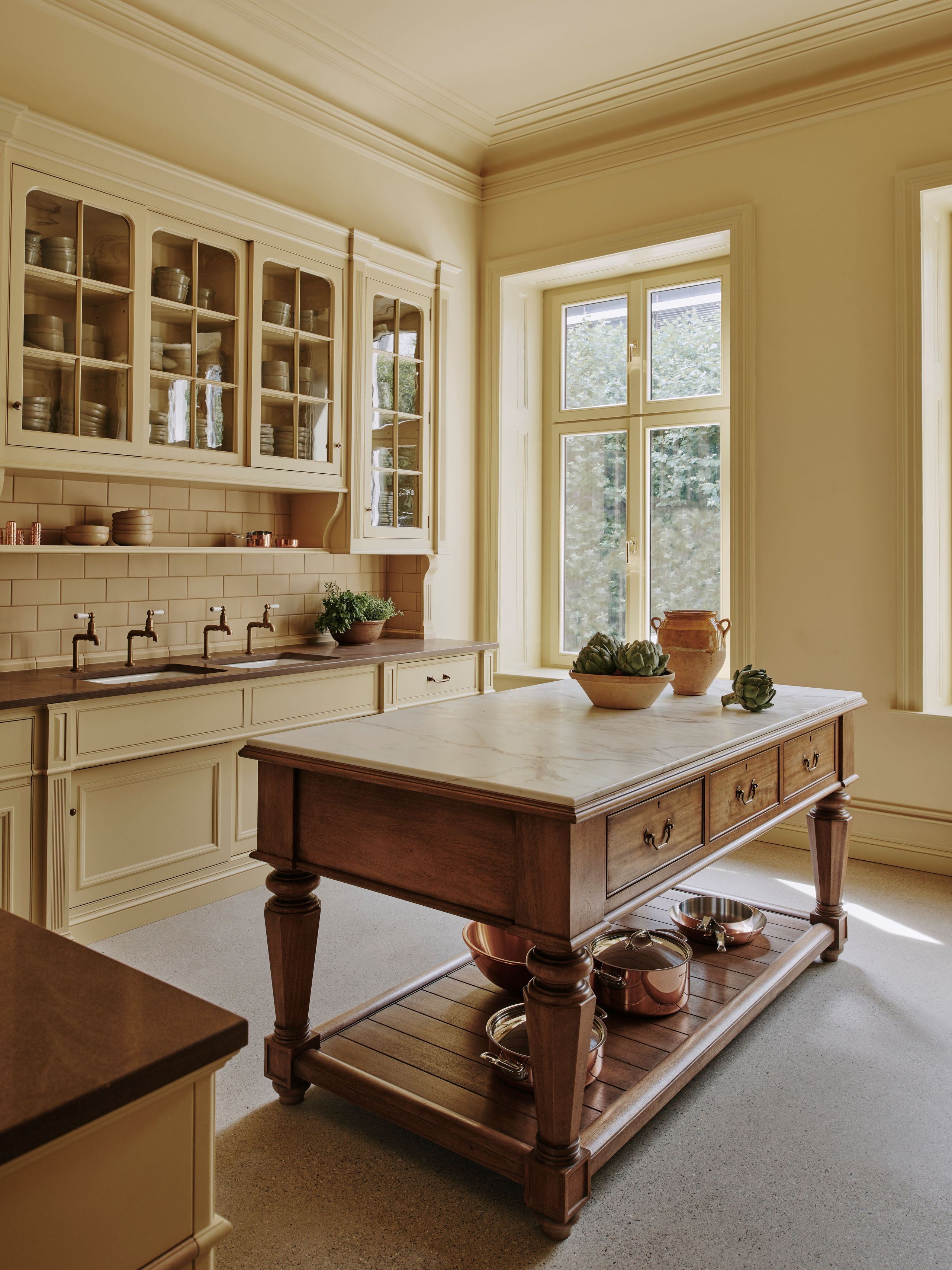 Image may contain: Indoors, Interior Design, Kitchen, Kitchen Island, Sink, Sink Faucet, Furniture, and Table