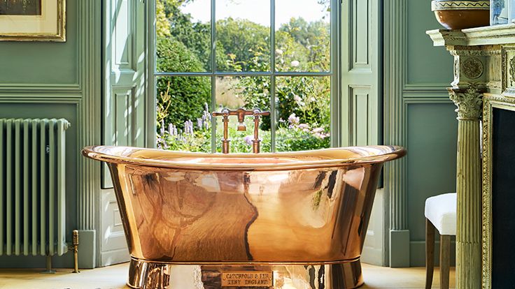 Image may contain: Tub, Bathing, Bathtub, Person, Indoors, Interior Design, Art, Painting, Chair, and Furniture