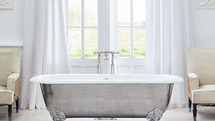 Image may contain: Tub, Bathing, Bathtub, Person, Chair, and Furniture