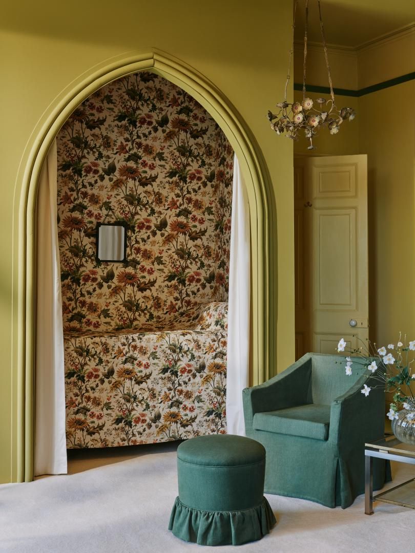 Image may contain: Furniture, Lamp, Chair, Arch, Architecture, and Home Decor