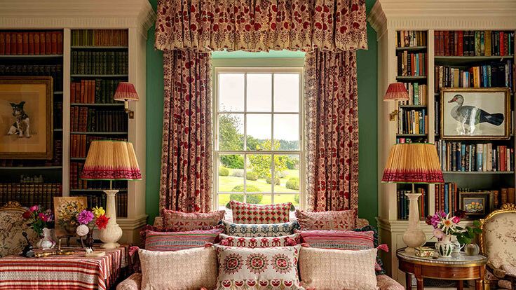 Image may contain: Home Decor, Lamp, Couch, Furniture, Chair, Cushion, Accessories, Bag, Handbag, Art, Painting, and Desk