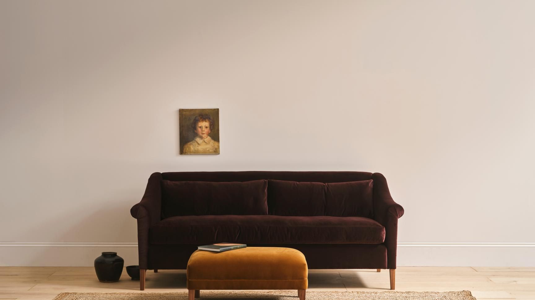 Image may contain: Couch, Furniture, Book, Publication, Home Decor, and Rug