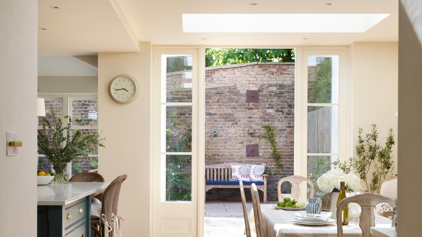 Image may contain: Door, Architecture, Building, Dining Room, Dining Table, Furniture, Indoors, Room, Table, Chair, and Bench