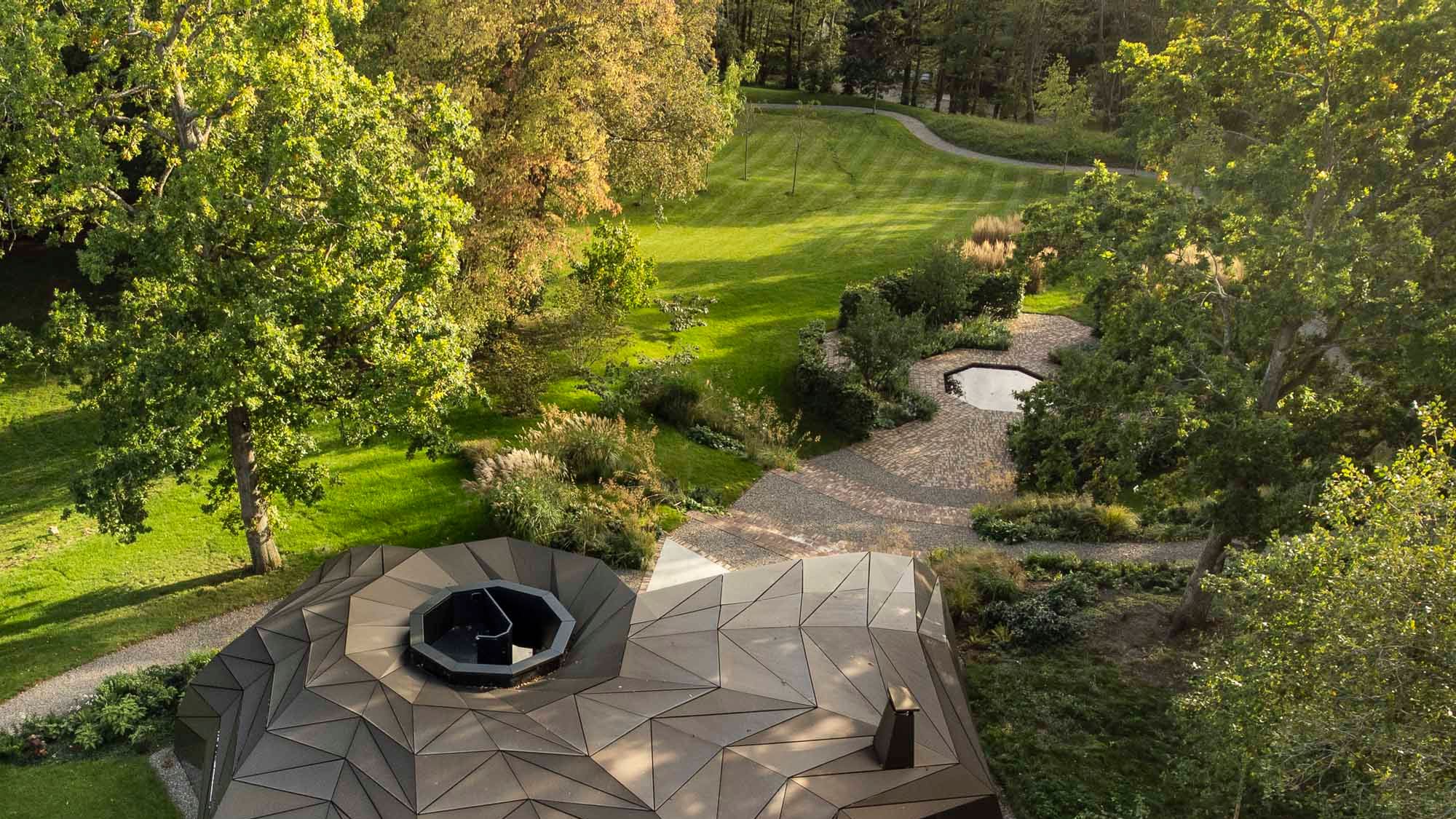 Image may contain: Outdoors, Grass, Plant, Architecture, Building, Housing, Backyard, Nature, Yard, House, and Aerial View