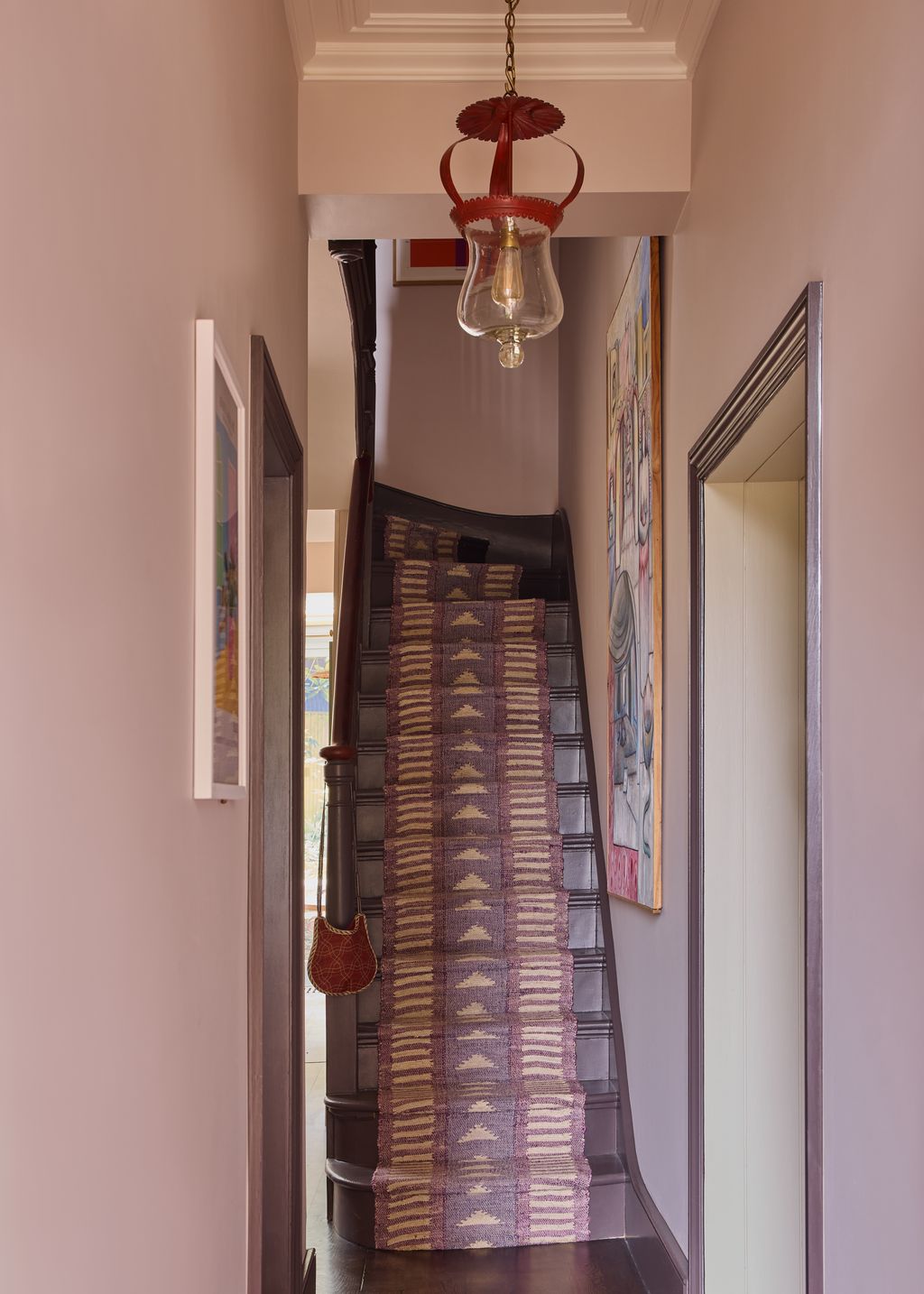 Image may contain Architecture Building House Housing Staircase Indoors Foyer Accessories Bag and Handbag