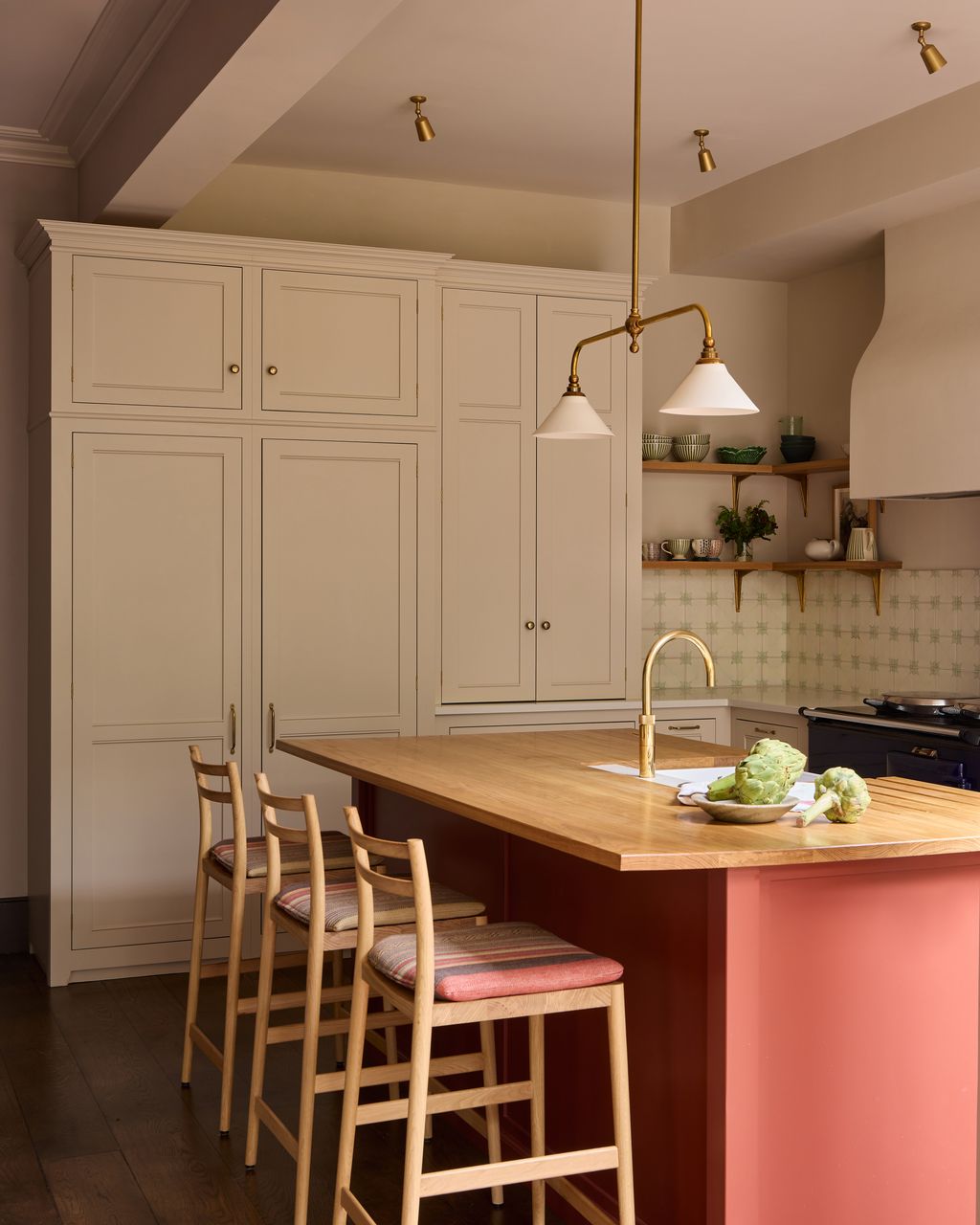 Image may contain Indoors Interior Design Kitchen Kitchen Island Furniture Sink Sink Faucet and Plant