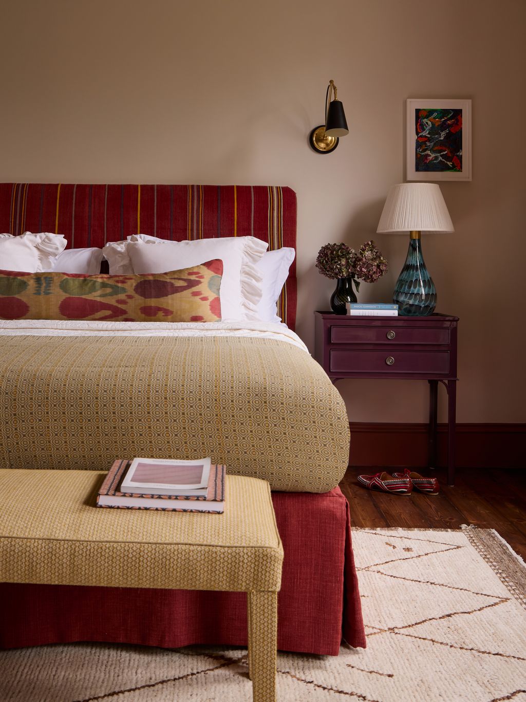 Image may contain Home Decor Lamp Cushion Indoors Interior Design Bed Furniture Table Lamp Rug Art and Painting