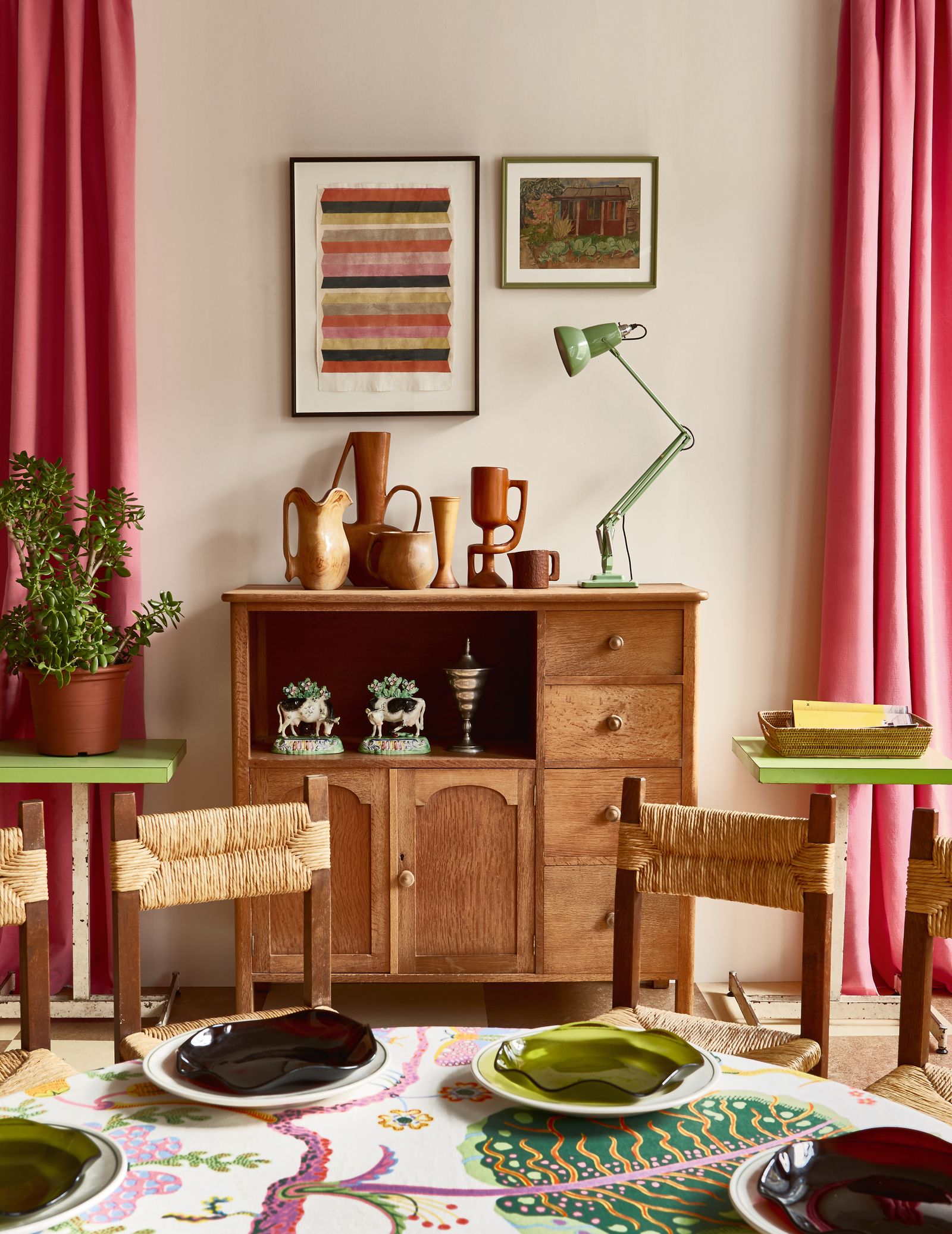 Image may contain Lamp Furniture Sideboard Indoors Interior Design Home Decor Plant Art Painting Table and Chair