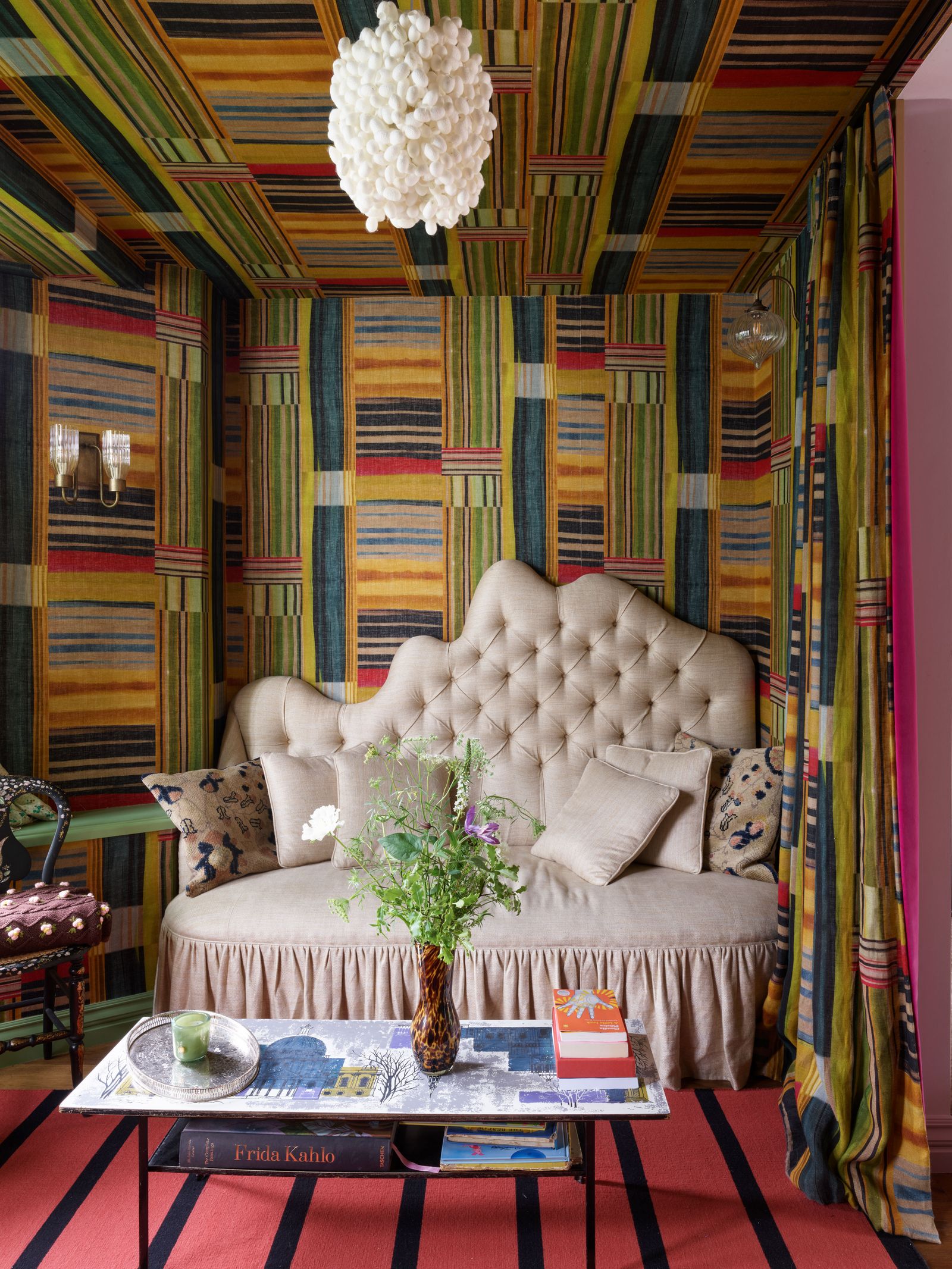 Image may contain Indoors Interior Design Architecture Building Furniture Living Room Room Couch Chair and Book