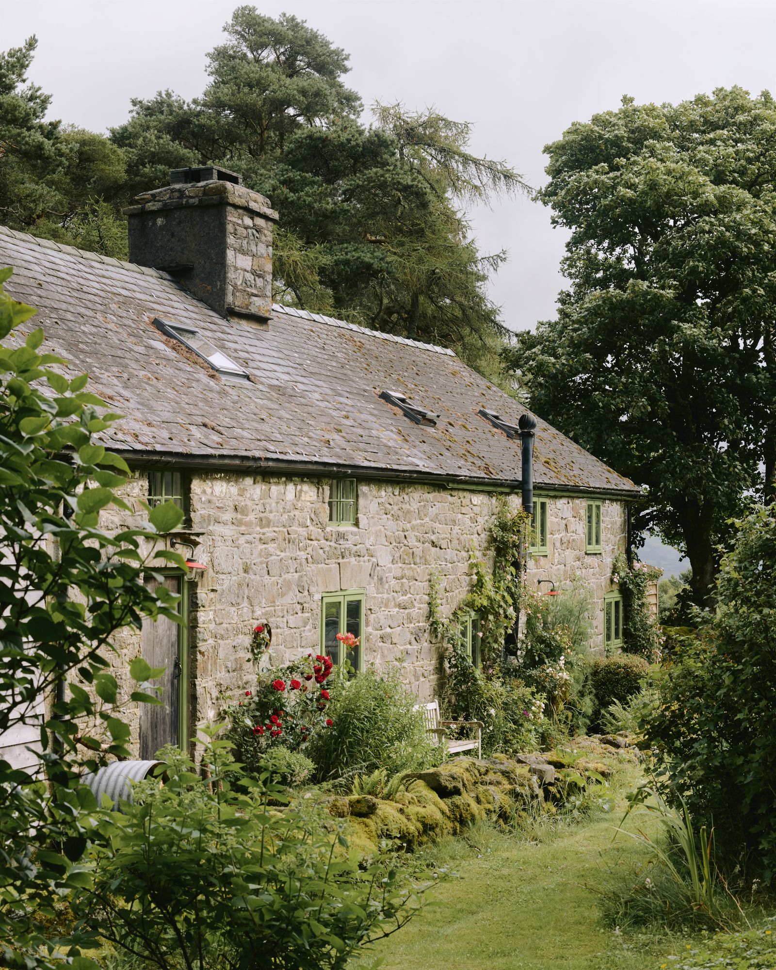 Image may contain Architecture Building Cottage House Housing Outdoors Nature Chair Furniture Animal and Mammal