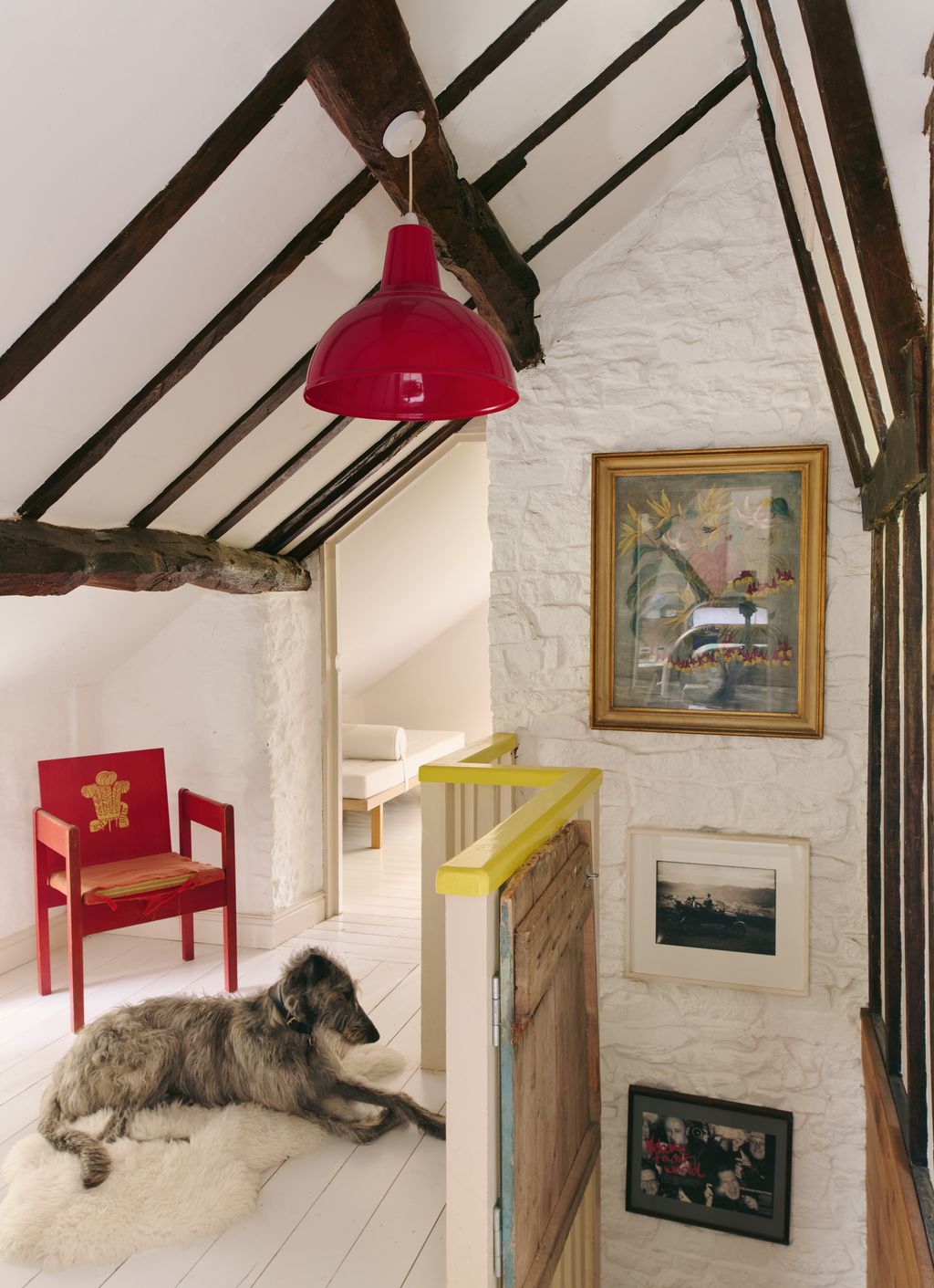 Image may contain Indoors Interior Design Chair Furniture Architecture Building House Housing Loft Room and Lamp