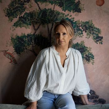 Image may contain: Caroline Dinenage, Blouse, Clothing, Adult, Person, Face, Head, Photography, Portrait, Blonde, and Hair