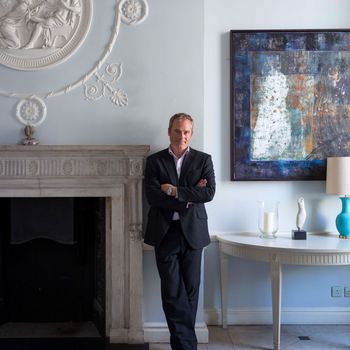 Image may contain: Person, Standing, Adult, Art, Painting, Lamp, Furniture, Table, and Wristwatch