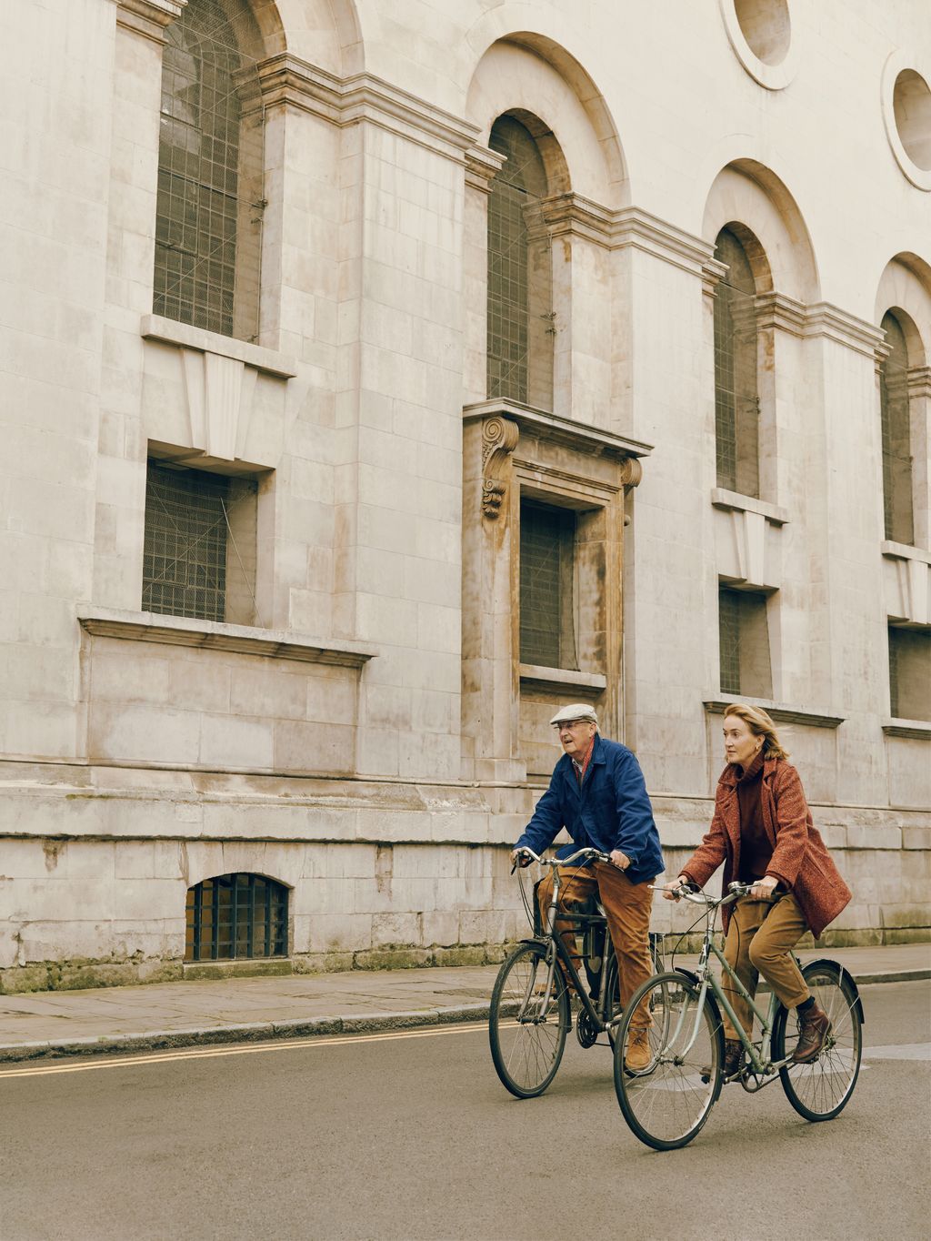 Image may contain Lisa Gerrard Joe Medicine Crow Clothing Glove Adult Person Footwear Shoe Hat and Bicycle