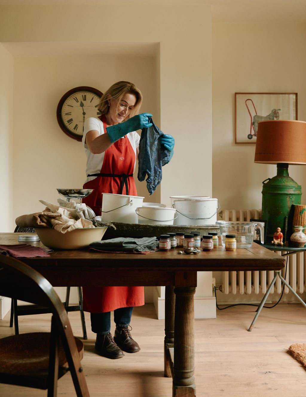 Image may contain Architecture Building Dining Room Dining Table Furniture Indoors Room Table Clothing and Glove