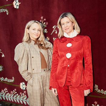 Image may contain: Adult, Person, Photobombing, Fashion, Clothing, Coat, Face, Head, Accessories, Jewelry, and Necklace