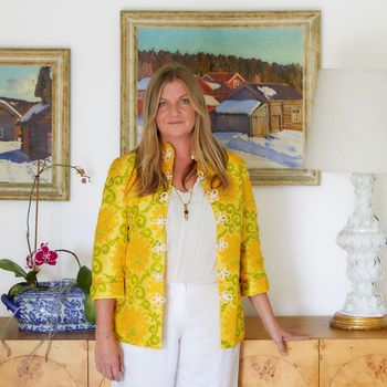 Image may contain: Blouse, Clothing, Sleeve, Coat, Art, Painting, Lamp, Adult, Person, Accessories, Jewelry, and Necklace