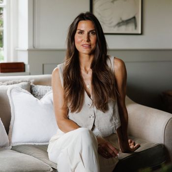 Image may contain: Lu Parker, Adult, Person, Art, Painting, Couch, Furniture, Accessories, Jewelry, Necklace, and Sitting