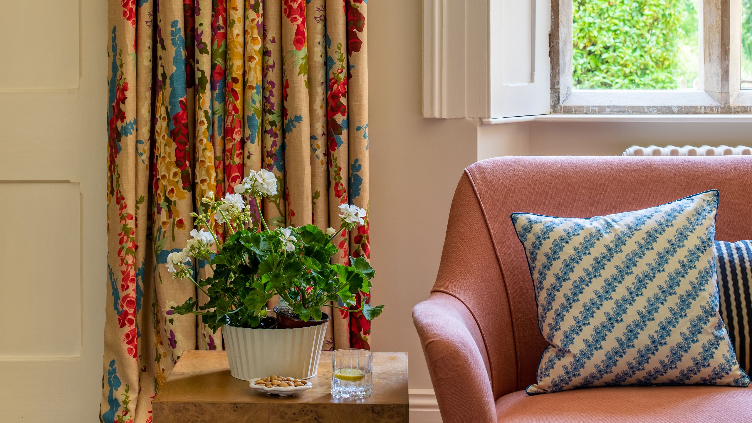 Image may contain: Cushion, Home Decor, Indoors, Interior Design, Cup, Pillow, Plate, Window, Couch, and Furniture