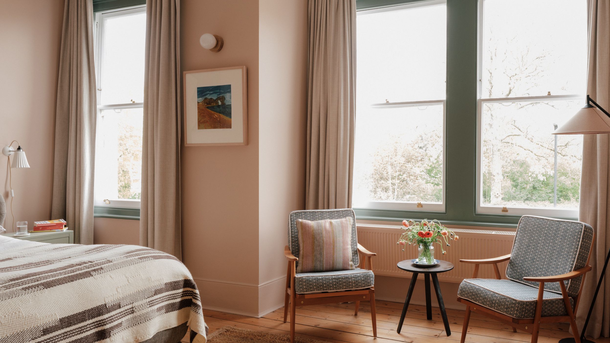 Image may contain: Chair, Furniture, Art, Painting, Bed, Home Decor, Lamp, Indoors, Interior Design, Window, and Rug