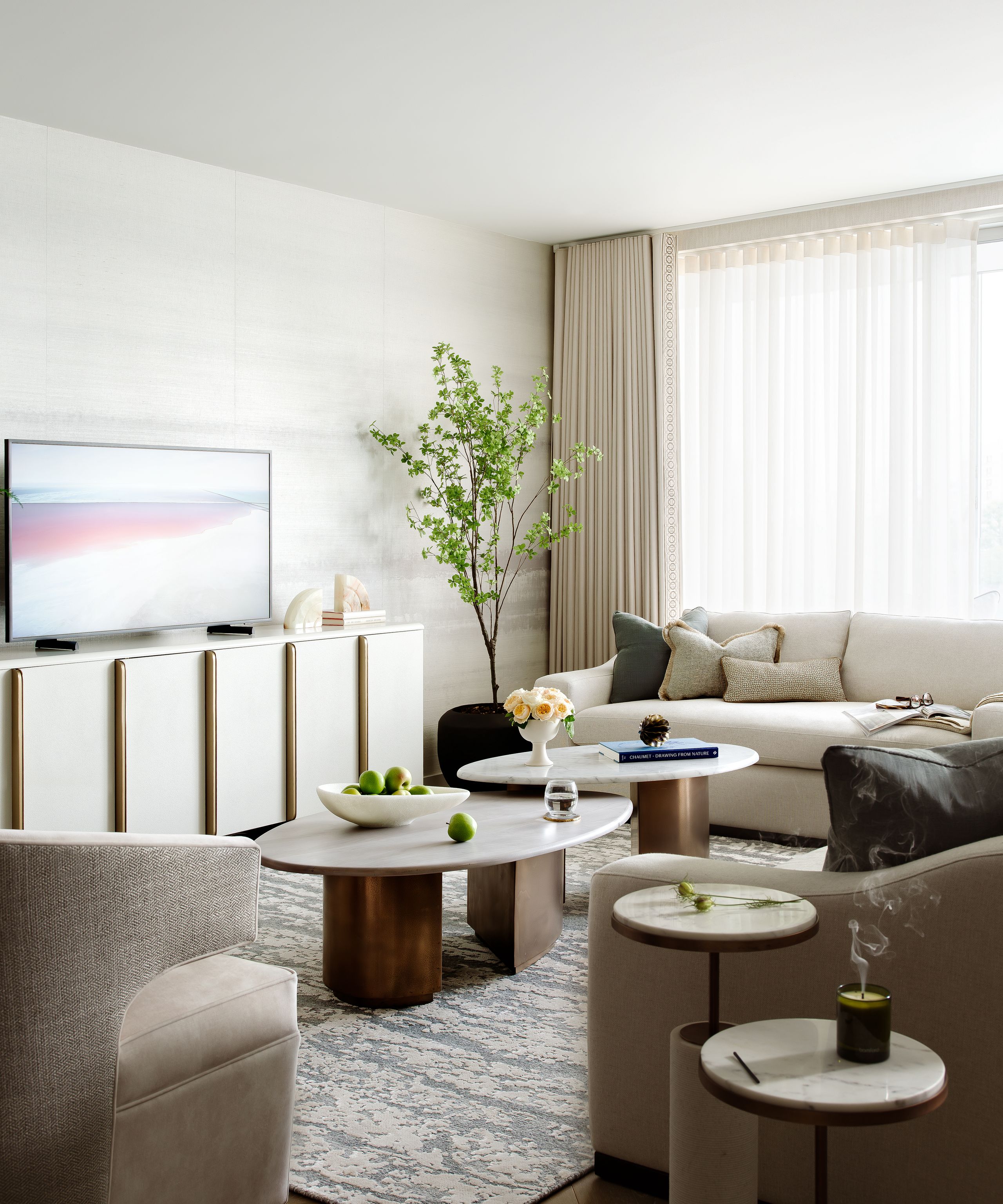 Image may contain: Coffee Table, Furniture, Table, Architecture, Building, Indoors, Living Room, Room, Home Decor, and Plant