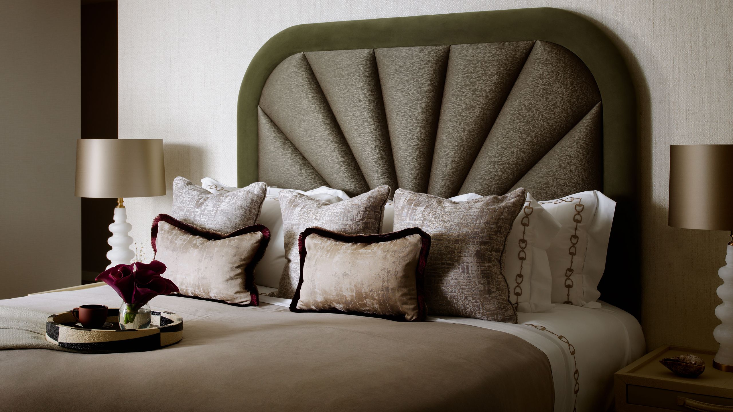 Image may contain: Cushion, Home Decor, Pillow, Lamp, Bed, Furniture, Table Lamp, Indoors, Interior Design, and Cup