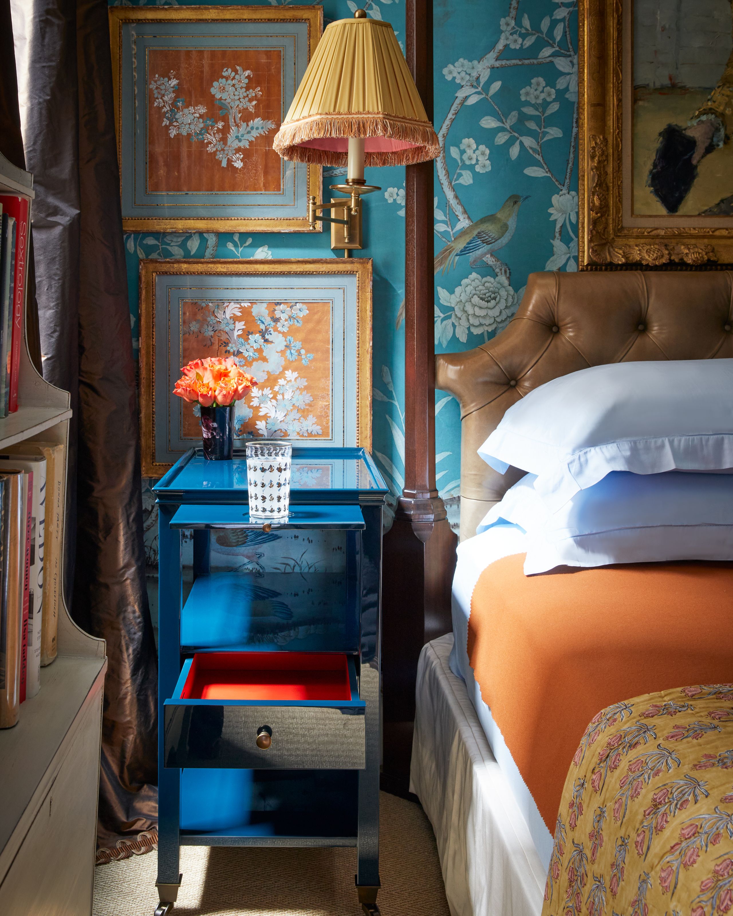 Image may contain: Lamp, Bed, Furniture, Art, Painting, Table Lamp, Cup, Adult, Person, Bedroom, Indoors, Room, and Animal