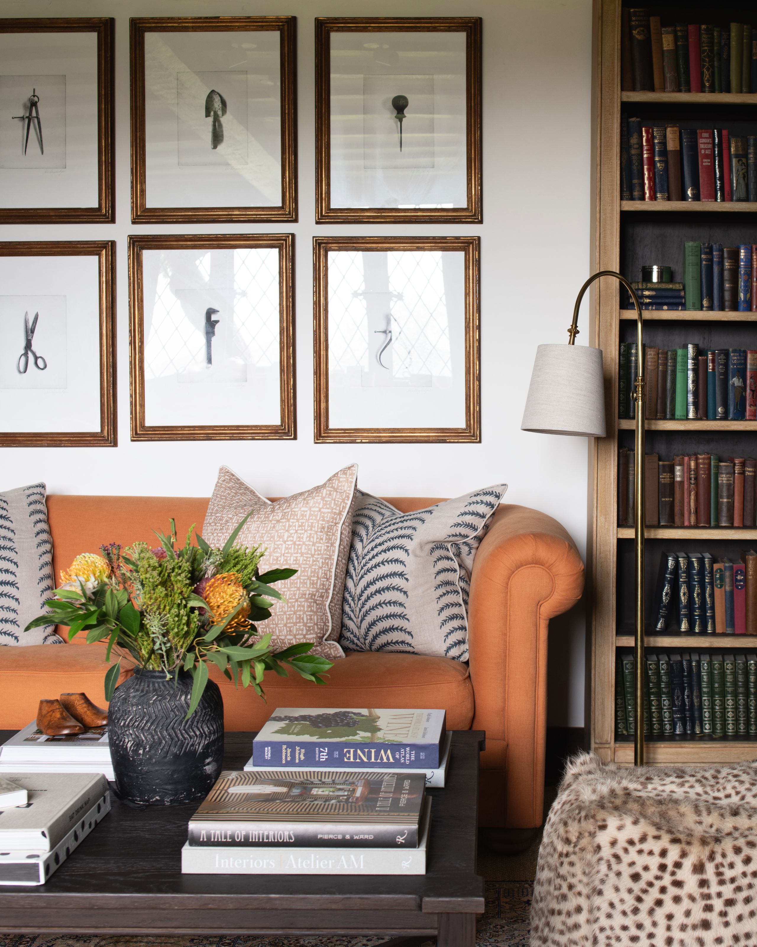 Image may contain: Furniture, Couch, Architecture, Building, Indoors, Living Room, Room, Desk, Table, Art, and Painting