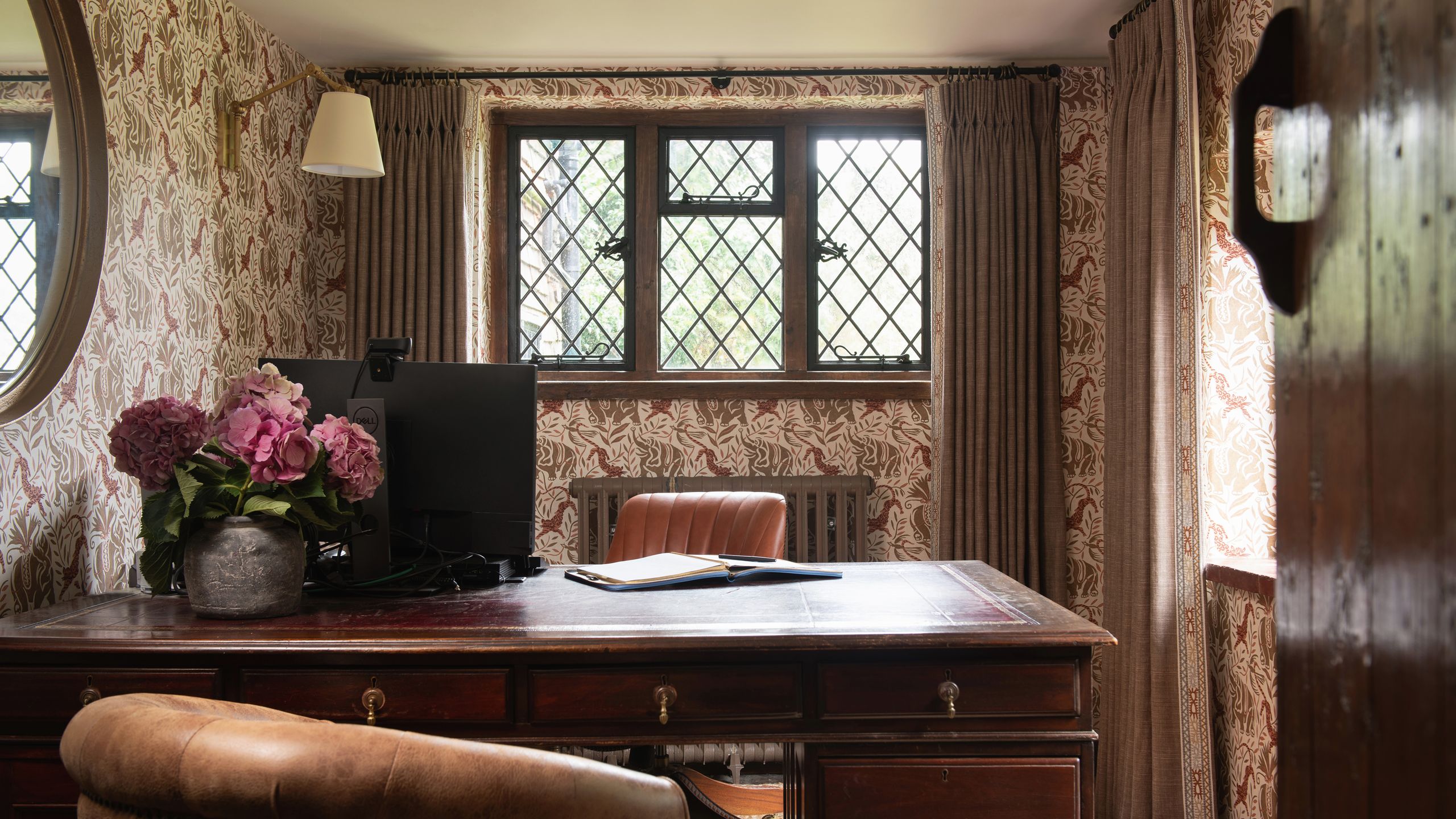 Image may contain: Indoors, Interior Design, Furniture, Table, Chair, Computer Hardware, Electronics, Hardware, and Monitor