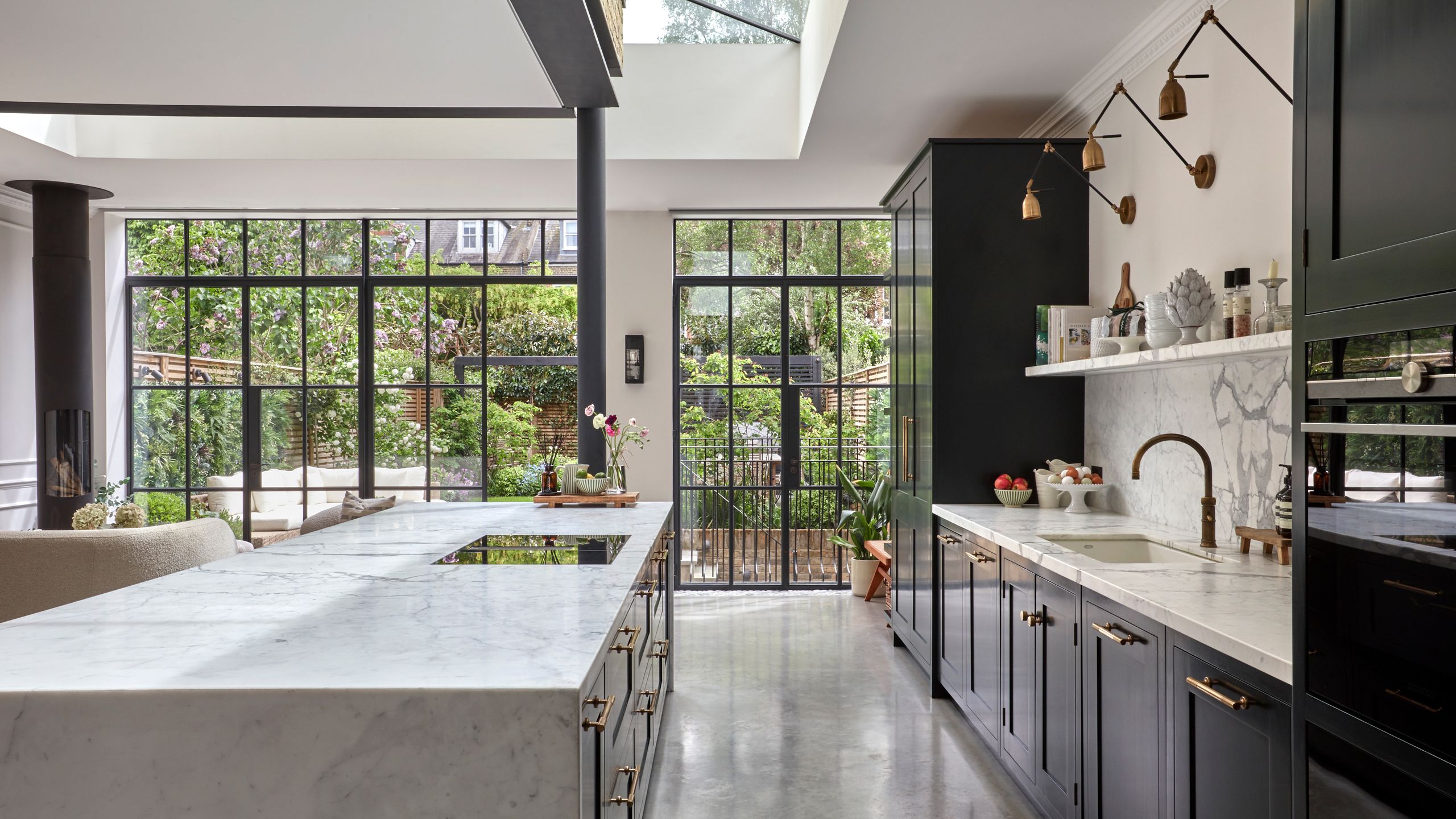 Image may contain: Indoors, Interior Design, Kitchen, Plant, Sink, Floor, Window, Computer Hardware, and Electronics