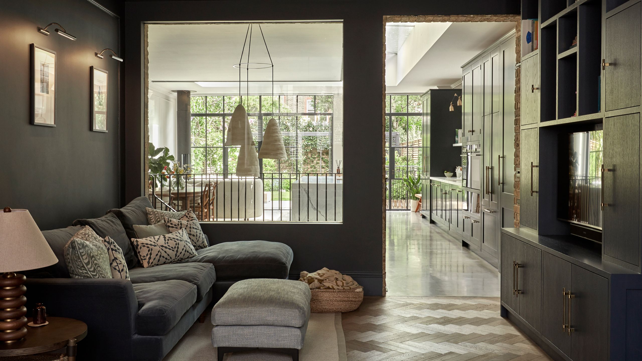 Image may contain: Door, Architecture, Building, Furniture, Indoors, Living Room, Room, Couch, Lamp, and Home Decor