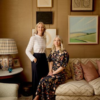 Image may contain: Lamp, Adult, Person, Table Lamp, Art, Painting, Couch, Furniture, and Chair