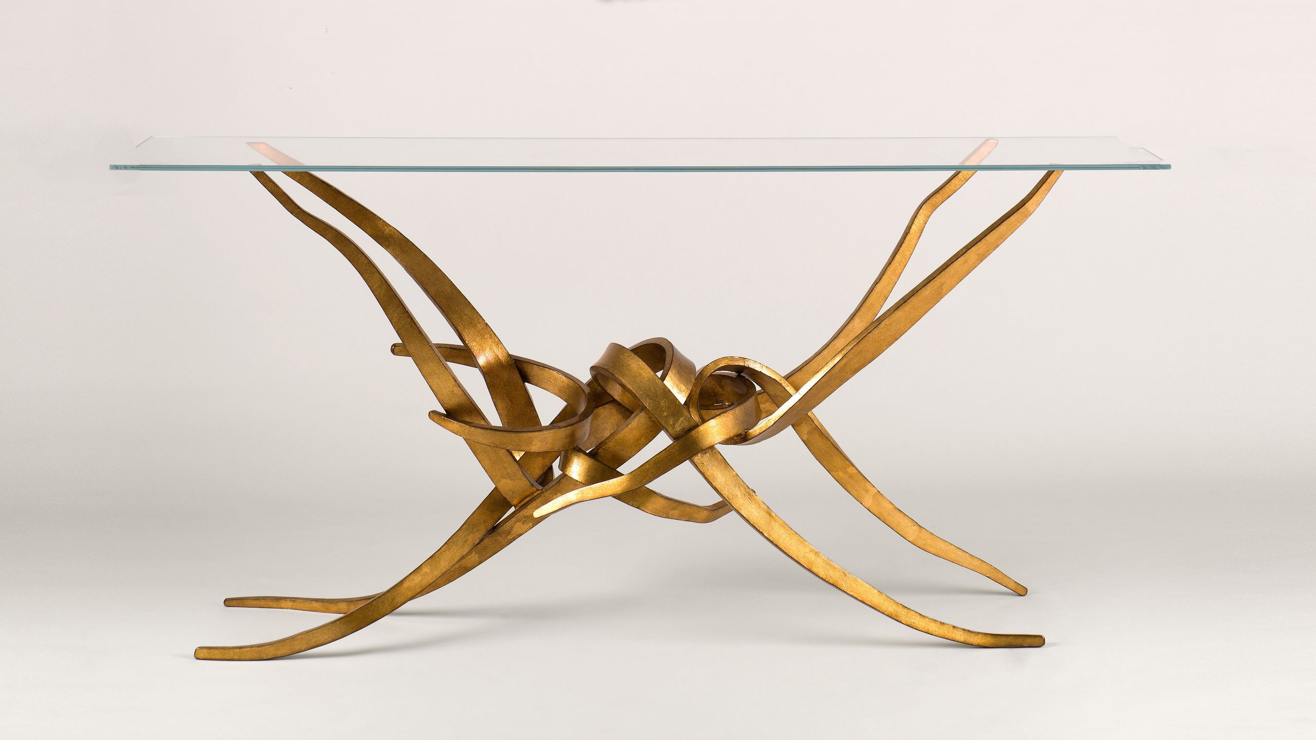 Image may contain: Furniture, Table, Coffee Table, Bow, Weapon, and Dining Table