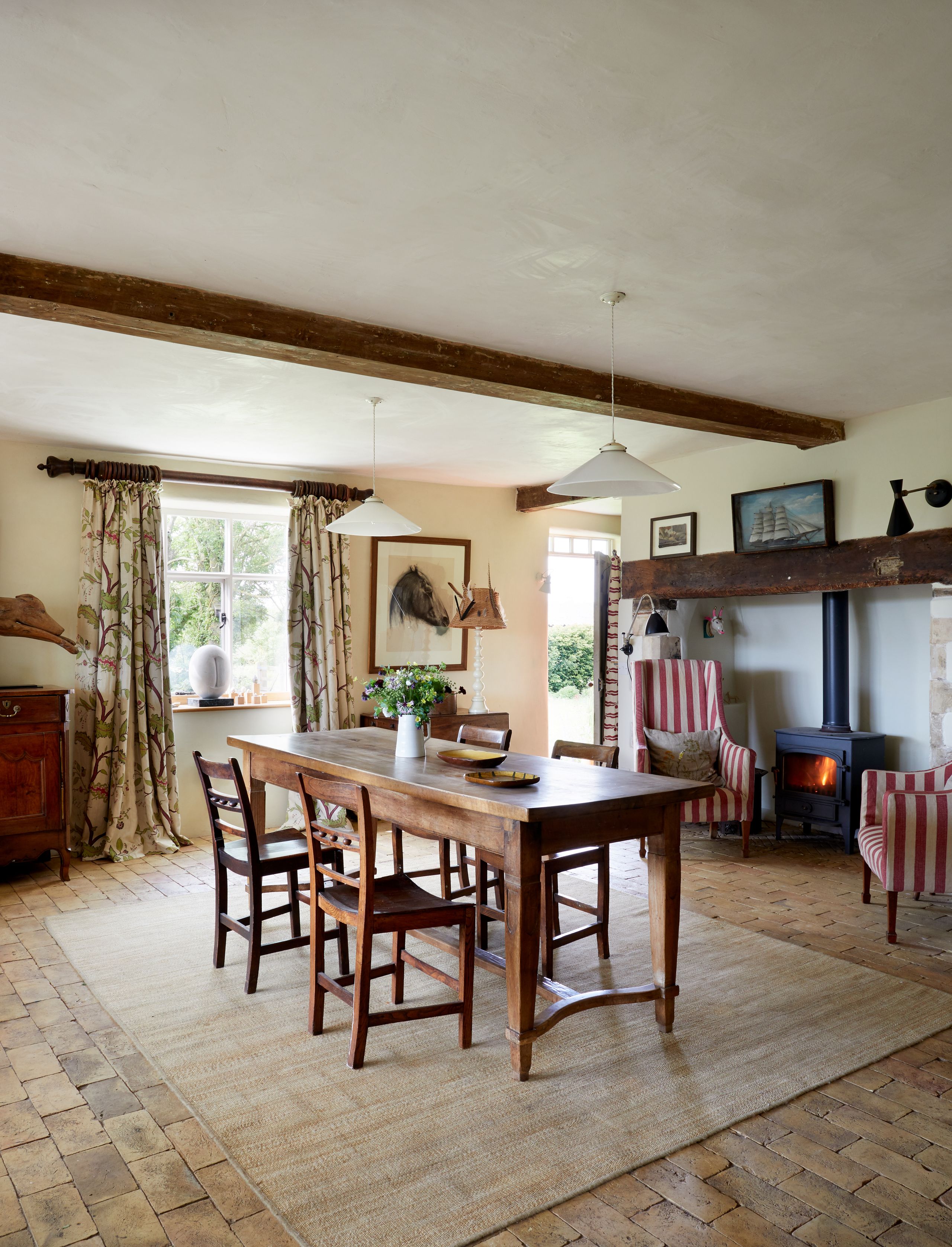 Image may contain: Architecture, Building, Dining Room, Dining Table, Furniture, Indoors, Room, Table, Lamp, Chair, and Floor