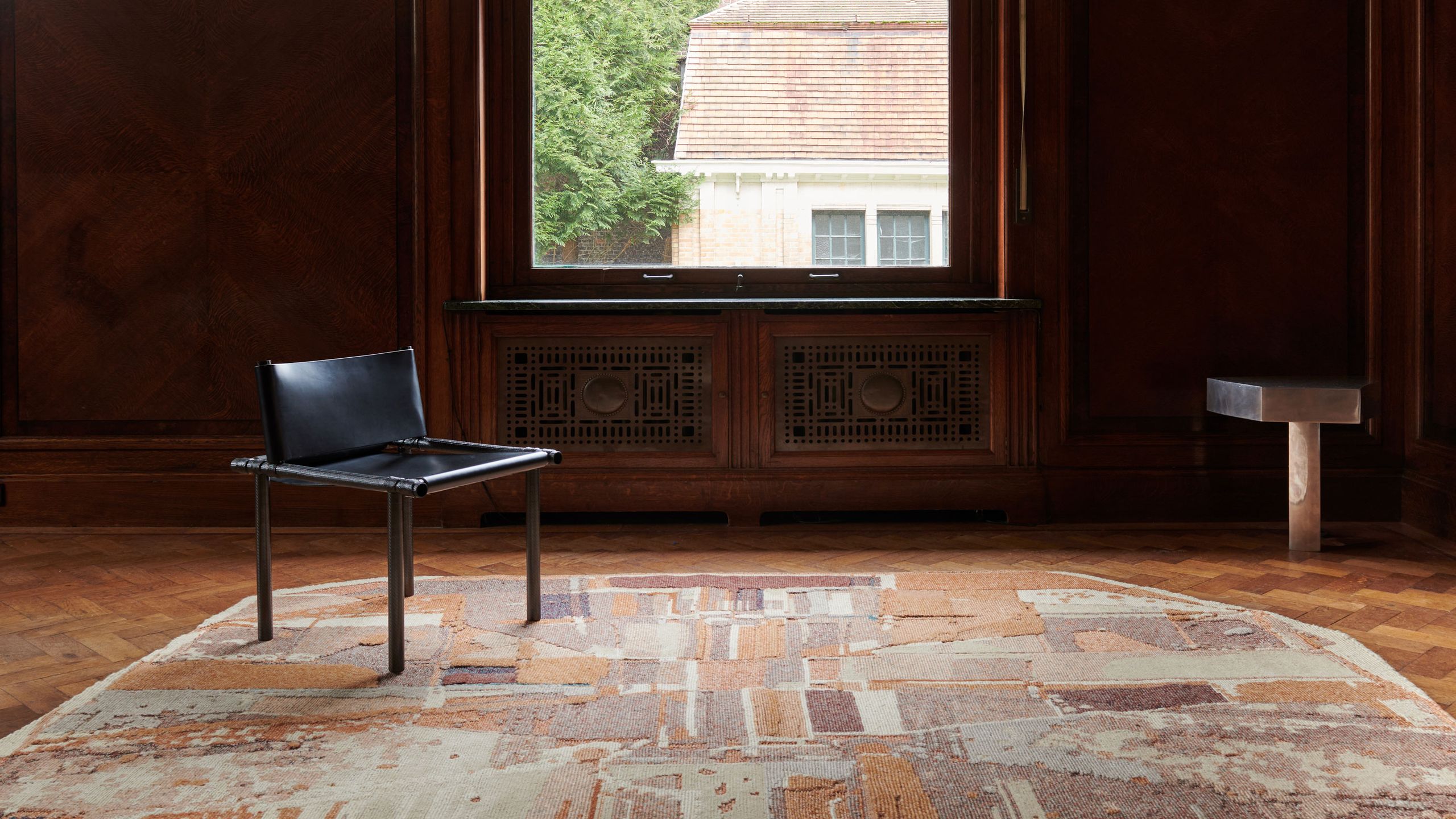 Image may contain: Floor, Flooring, Home Decor, Rug, Indoors, Interior Design, Chair, Furniture, Wood, and Hardwood