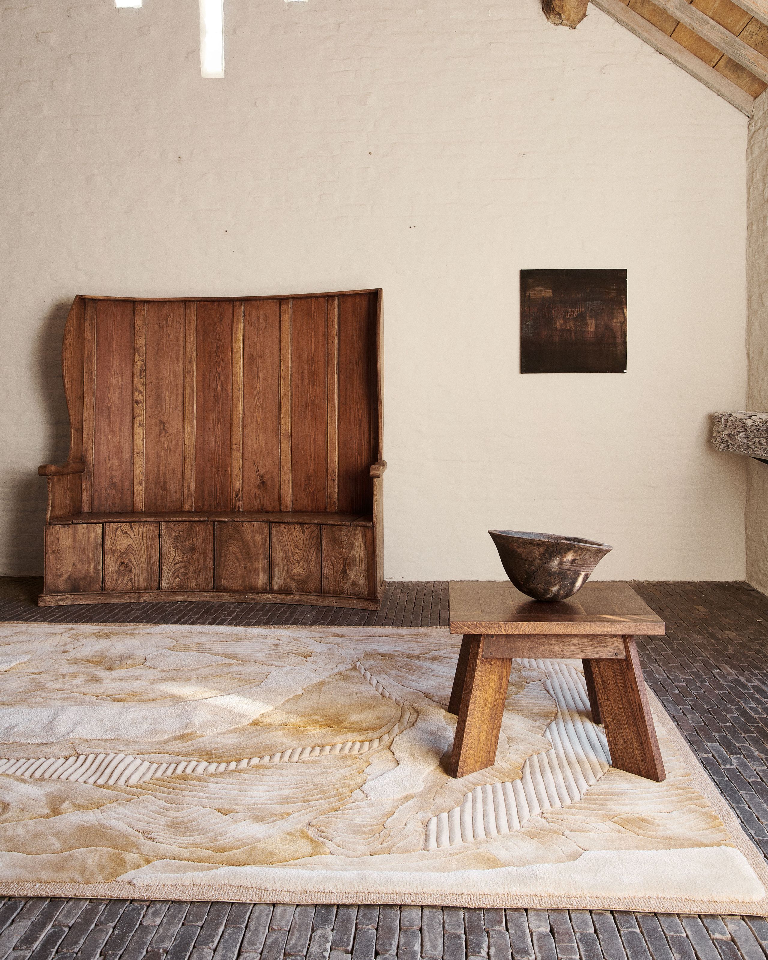 Image may contain: Home Decor, Indoors, Interior Design, Wood, Hardwood, Stained Wood, Rug, Floor, and Plywood