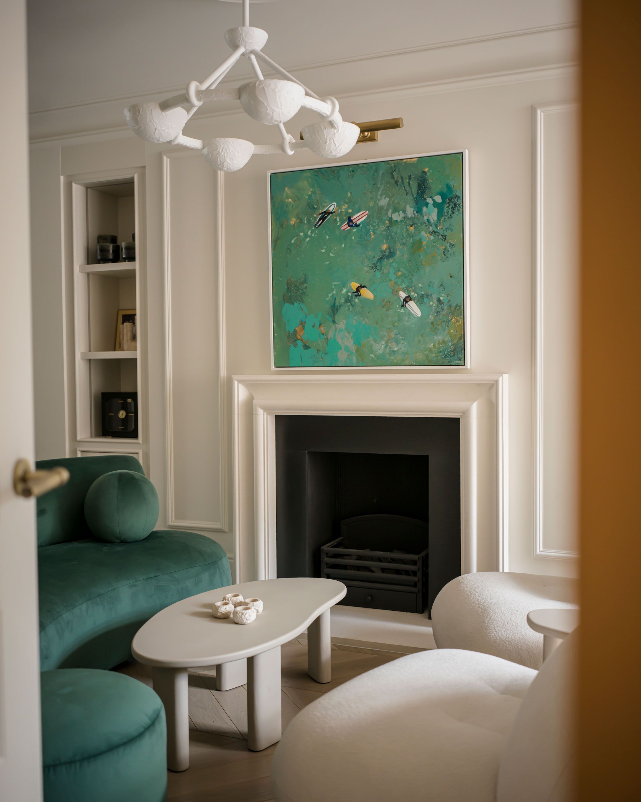 Image may contain: Fireplace, Indoors, Art, Painting, Home Decor, Furniture, Architecture, Building, Living Room, and Room