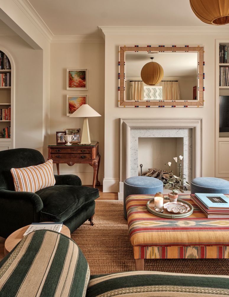 Image may contain: Home Decor, Lamp, Furniture, Art, Painting, Couch, and Candle