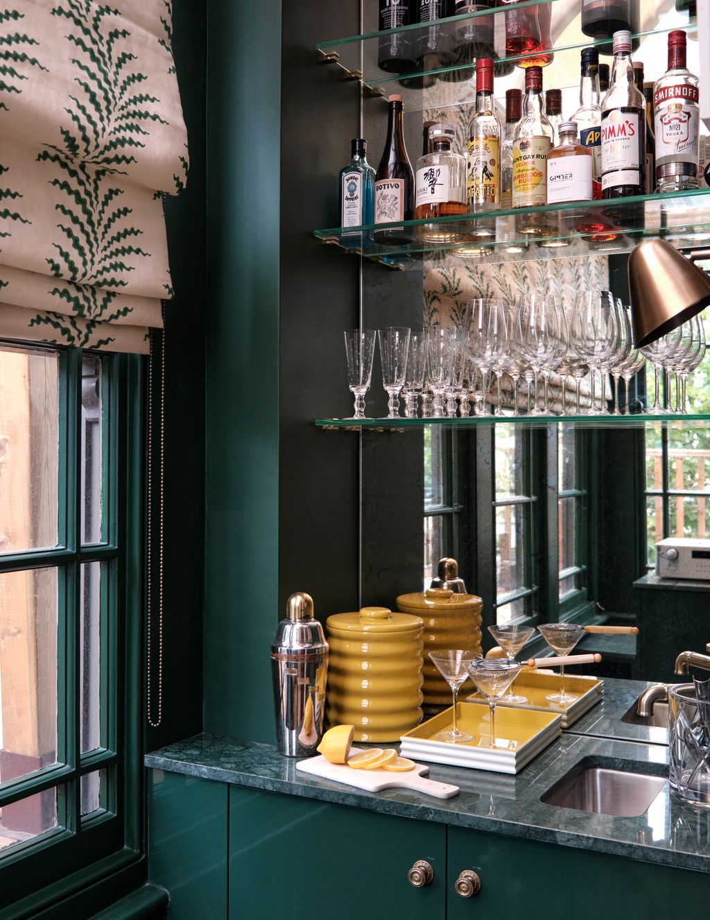 Image may contain Sink Person Cup Shelf Bottle Shaker and Lamp