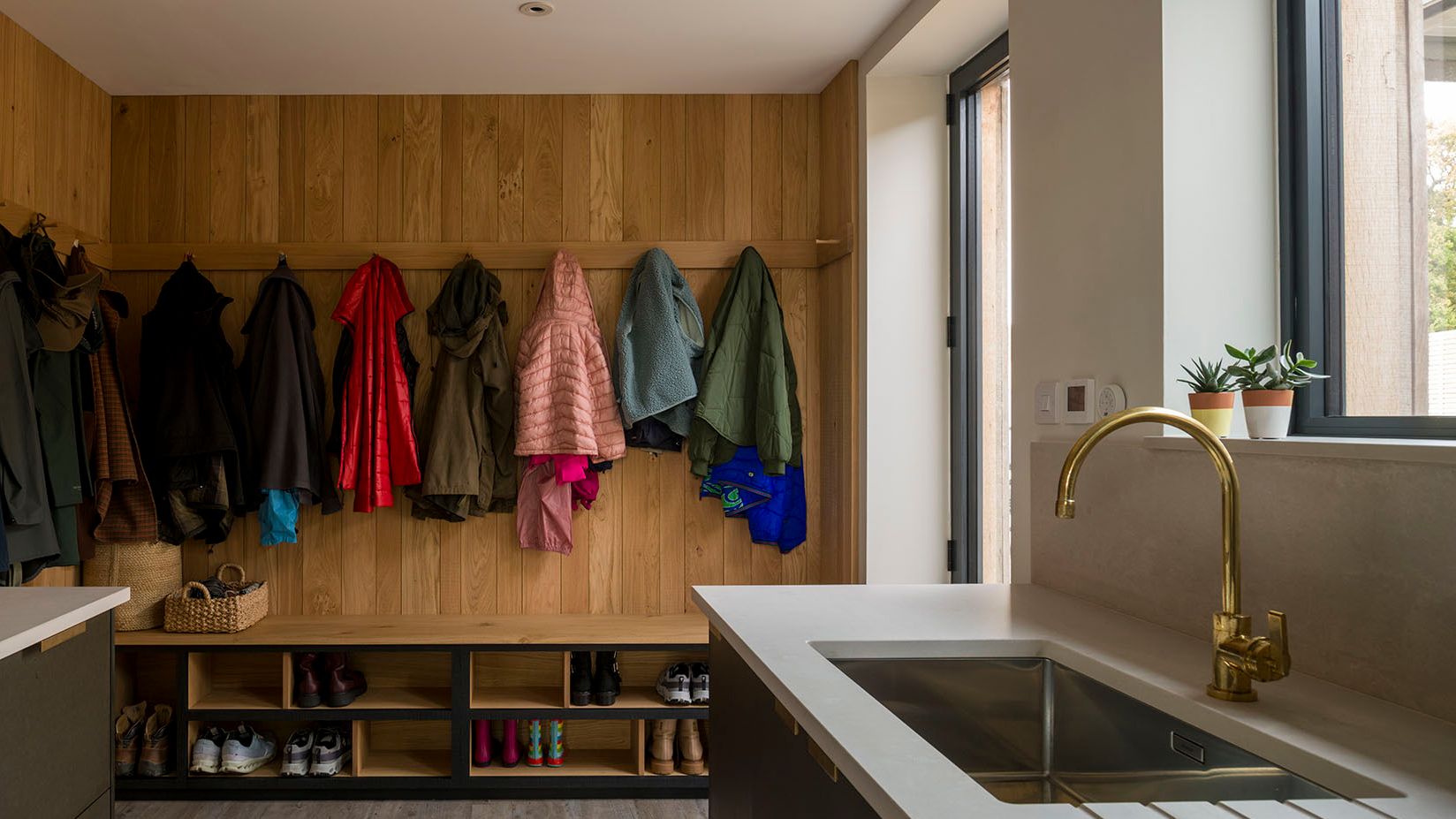 Image may contain: Indoors, Interior Design, Sink, Sink Faucet, Plant, Clothing, Footwear, Shoe, and Furniture